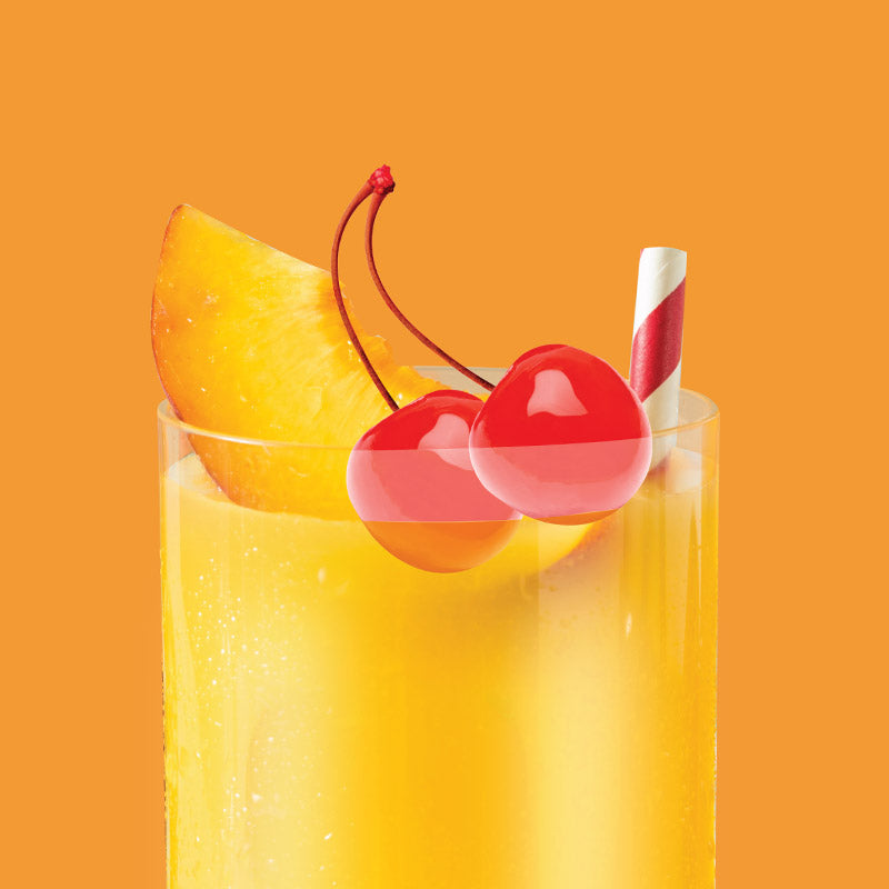 Glass of ClapBack Pushin Peach Wine with a peach slice, cherry, and straw on an orange background