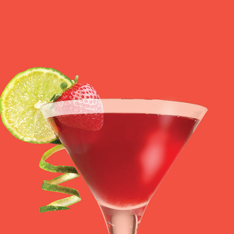 ClapBack Slept On Strawberry wine cocktail in a martini glass with a strawberry and lime garnish on a red background