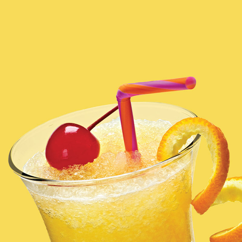 Glass of ClapBack Where'd My Mango wine drink with a cherry, orange slice, and pink straw on a yellow background