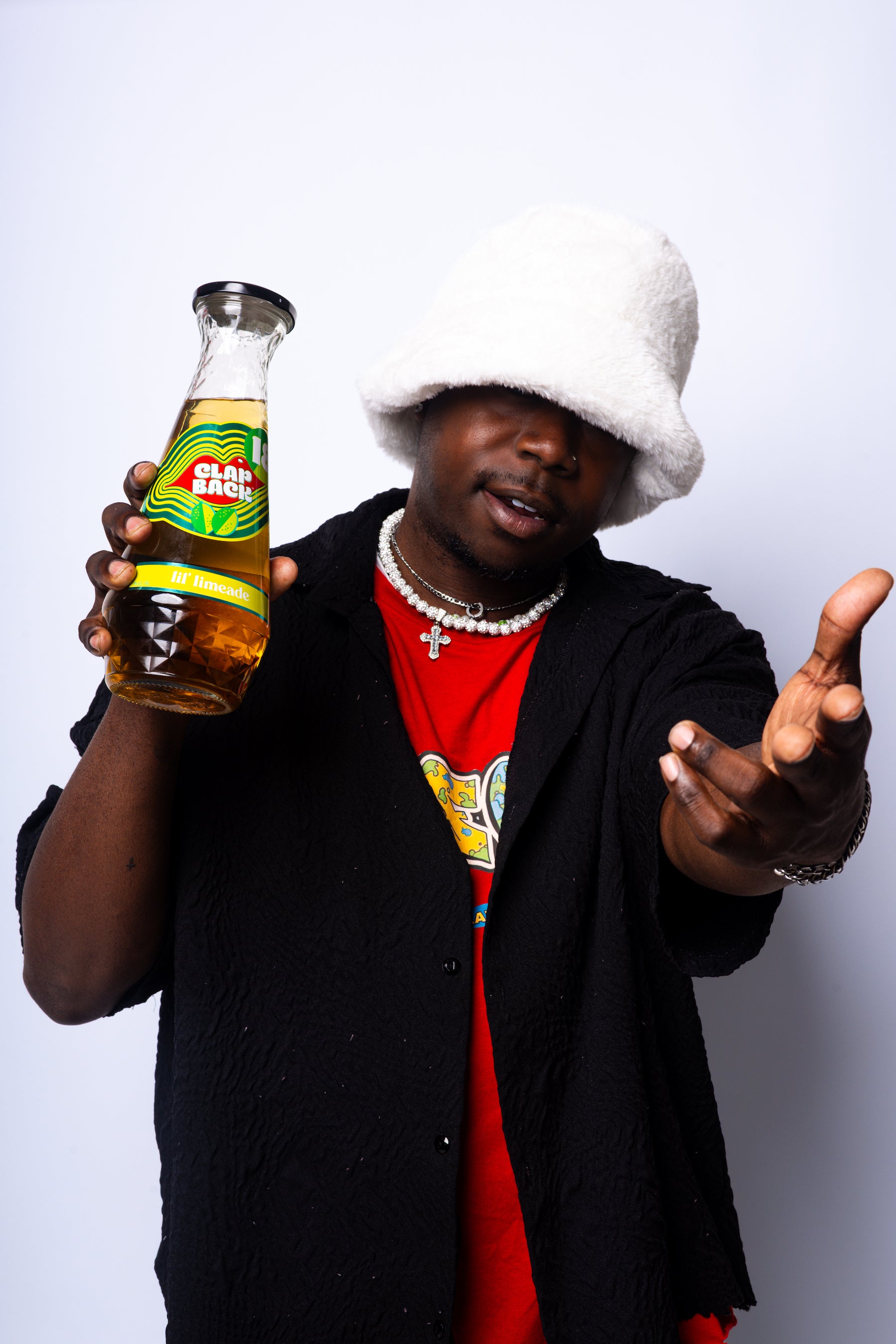 Person holding a bottle of wine with a white background